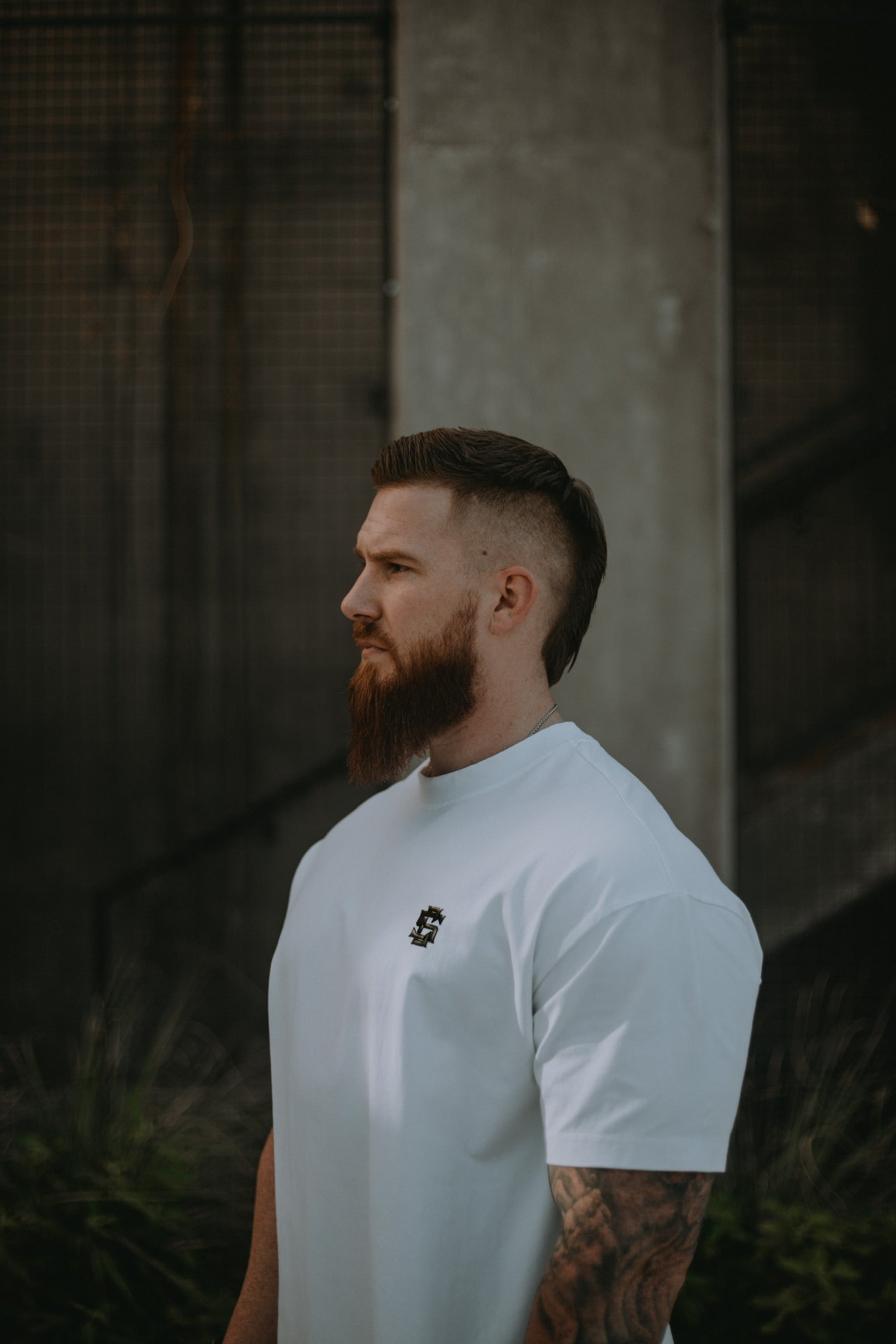 Male model in Covenant Collection Brushed White Oversized Tee. 